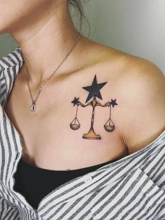 Hình xăm cân thiên bình và ngôi sao trên ngực hình xăm chiếc cân thiên bình kết hợp ngôi sao ở ngực