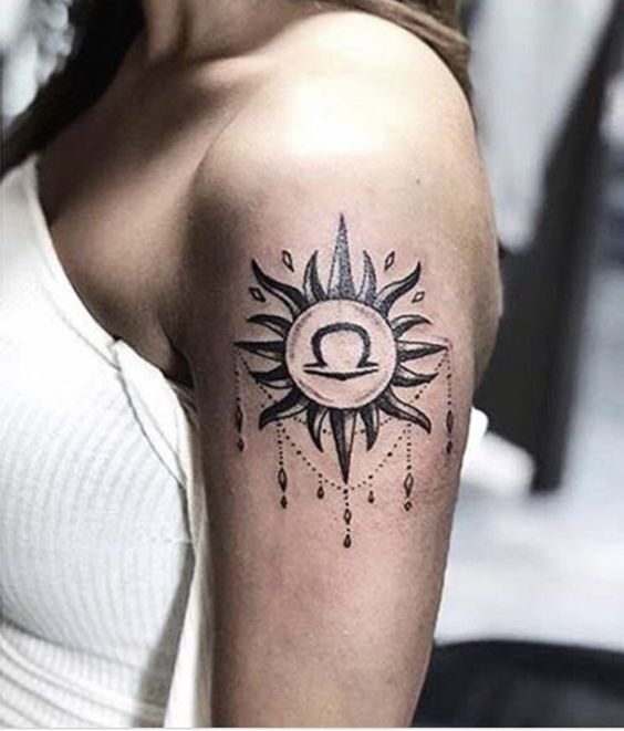 Hình xăm biểu tượng mặt trời và cung thiên bình cách điệu trên bắp tay hình xăm biểu tượng cung thiên bình và mặt trời cách điệu ở bắp tay