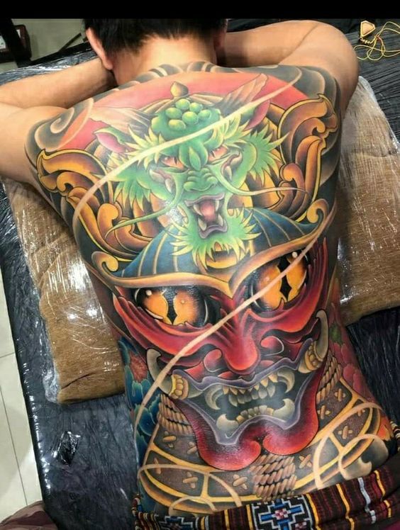 Hình xăm mặt quỷ và lưng rồng xanh tattoo bít lưng mặt quỷ và rồng xanh