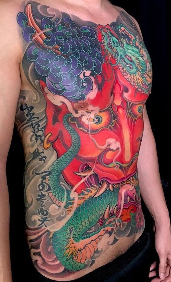 Hình xăm mặt quỷ Yaksha kết hợp họa tiết thanh long và hoa huệ nhện tattoo mặt quỷ dạ xoa kết hợp họa tiết thanh long và hoa bỉ ngạn