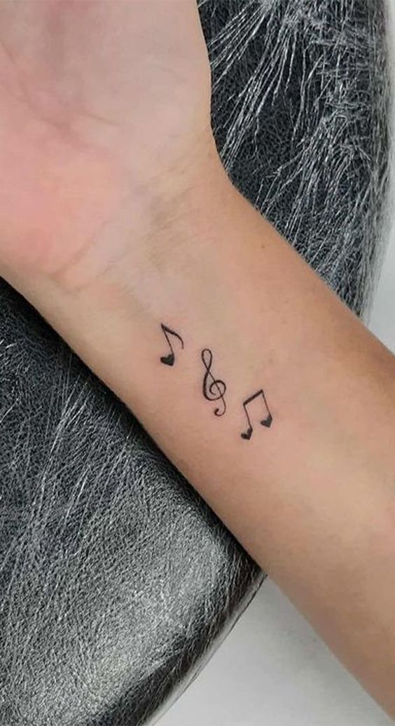 xăm những nốt nhạc nhỏ dễ thương lên cánh tay của bạn tattoo các nốt nhạc nhỏ xinh trên cánh tay