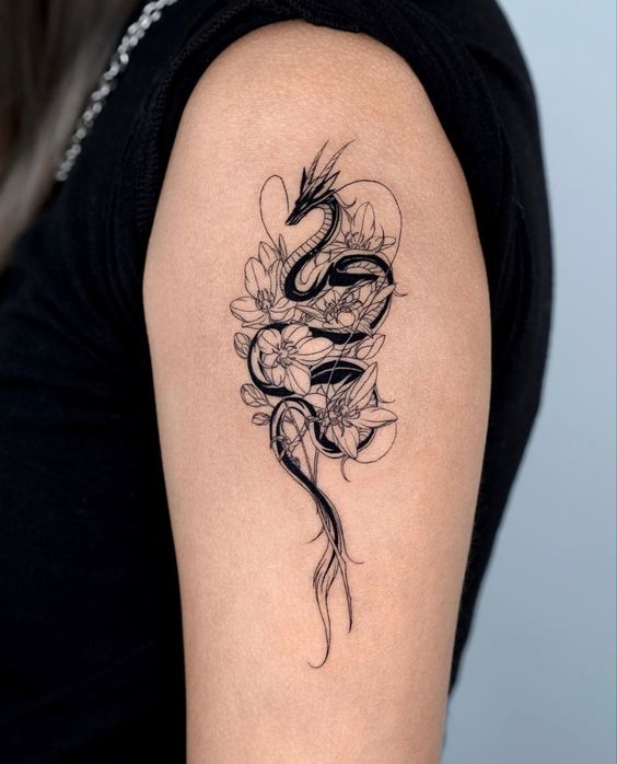 Hình xăm rồng đen đơn sắc và hoa anh đào trên bắp tay 200+ hình xăm rồng mang phong cách nhật cổ đến tả thực cực đẹp - Genztattoo