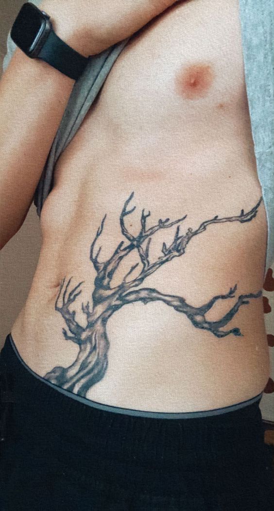 Hình xăm cành cây ở bên cạnh cho thấy sự gai góc Top 888+ hình xăm bên hông siêu cuốn hút - Genztattoo