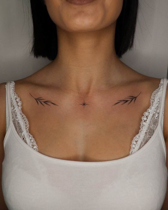 Hình xăm hai chiếc lá đối xứng nhỏ trên xương đòn hình xăm hai lá mini đối xứng ở xương quai xanh