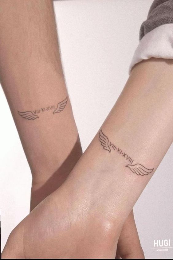 hình xăm cặp cánh thiên thần kết hợp dòng số la mã cho cặp đôi hình xăm cặp cánh thiên thần kết hợp dòng số la mã cho cặp đôi